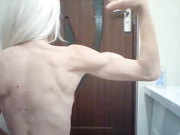 Skinny girl flexing hard biceps